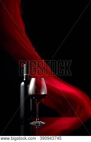 Red Wine On A Black Background. Copy Space.