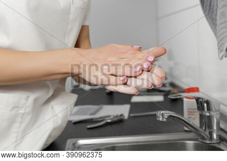 Women Hand Apply Talcum Powder. Doctor Puts Talcum Powder On His Hands Before Putting On Gloves