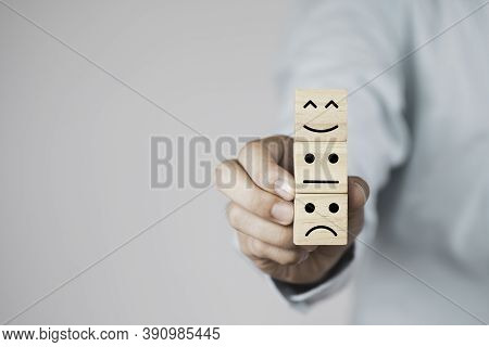 Select Emotion Or Mood Concept , Hand Holding And Stacking Smile Face  Or Happy Face Which Print Scr