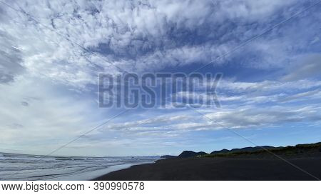 Khalaktyrsky Beach, Kamchatka Peninsula. Black Volcanic Sand Beach. Beautiful Blue Sea. Waves Roll I