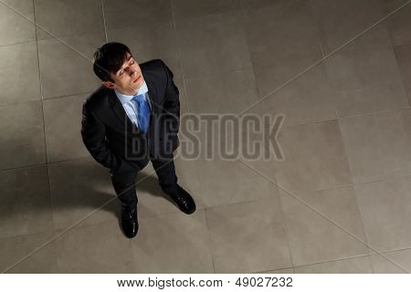 Young businessman with his eyes closed