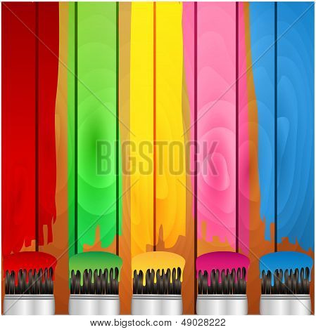 coloured stripes of paint and brush on a background wooden boards