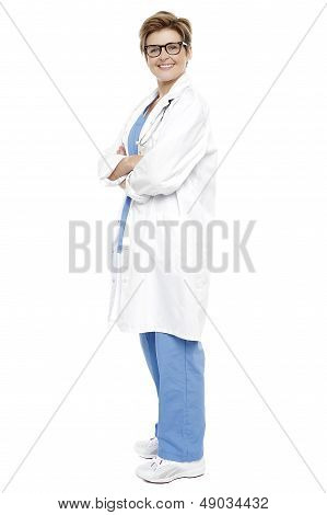 Full Length Portrait Of A Smiling Female Doctor
