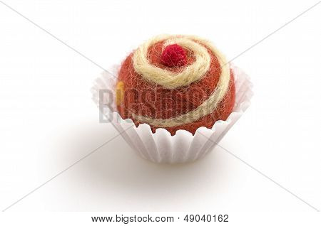 colorful felt praline on a white background