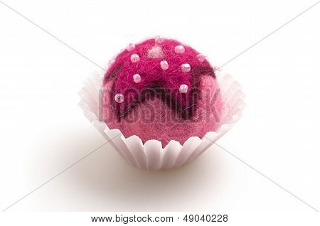 colorful felt praline on a white background