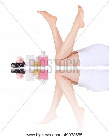 Beautiful Female Legs And Spa Items With Reflectionl