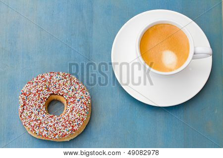 breakfast with fresh coffee and one donut