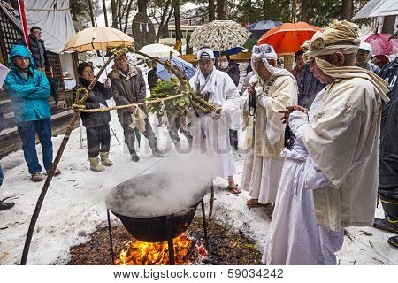 NAGANO, JAPAN - FEB 4, 2013: Shinto Ascetics perform ancient purifying rites. Known as Yamabushi, they are mountain hermits with a long tradition of mysticism.