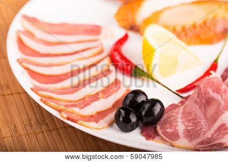 Sliced meat on the white plate