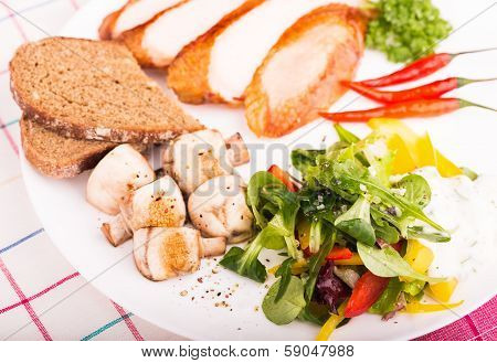 Plate with salad, fried mushrooms