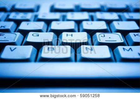 Computer Keyboard In Blue Light