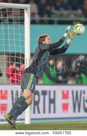 VIENNA,  AUSTRIA - MARCH 22 Gunnar Nielsen (#1 Faroe Islands) catches the ball during the world cup qualifier game on March 22, 2013 in Vienna, Austria.