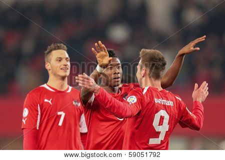 VIENNA,  AUSTRIA - MARCH 22 Andreas Weimann (#9 Austria) and David Alaba (#8 Austria) celebrate a goal during the world cup qualifier game on March 22, 2013 in Vienna, Austria.