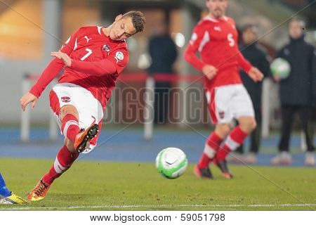 VIENNA,  AUSTRIA - MARCH 22 Marko Arnautovic (#7 Austria) kicks the ball during the world cup qualifier game on March 22, 2013 in Vienna, Austria.