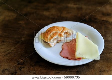 Bitten Bun with ham and cheese