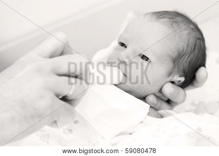 Cute Newborn Boy Eats