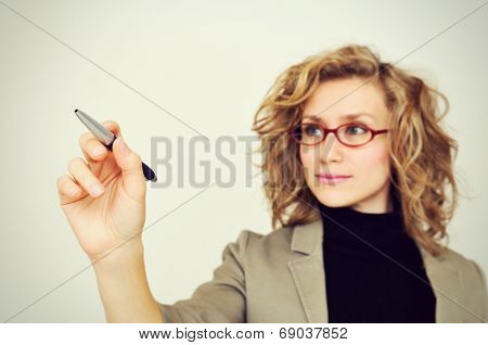 Businesswoman Drawing Graph With Pen