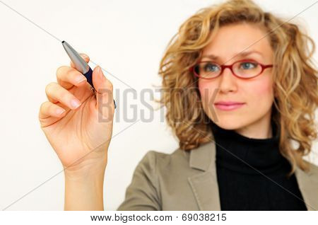 Businesswoman Drawing Graph With Pen