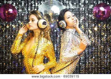 Two Beautiful Sexy Disco Women In Gold And Silver Catsuits Dancing