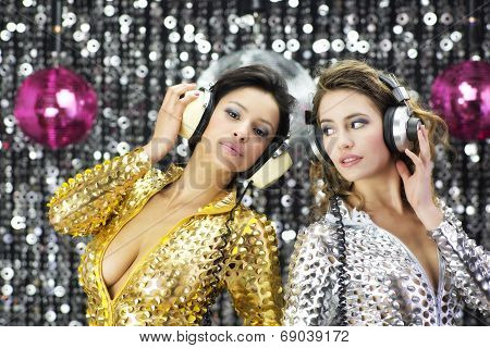 Two Beautiful Sexy Disco Women In Gold And Silver Catsuits Dancing