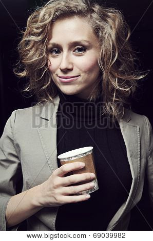 Blond Young Businesswoman In Office With Coffee