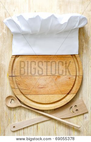 Chef hat on cutting board abstract food concept