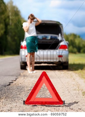 Woman With Telephone Near The Broken Car