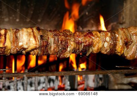 Skewers Of Meat Cooked On A Spit In The Fireplace 2