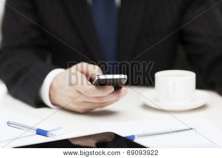 business, technology and interent concept - businessman with smartphone reading news
