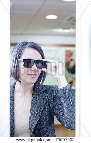 Woman Trying On Sunglasses