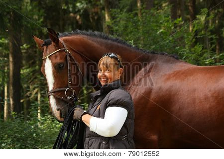 Elderly Woman And Brown Horse Portrait In The Forest