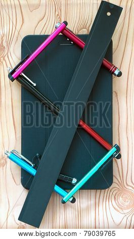 Business composition of modern things business man: stylus in the form of the dollar and tablet