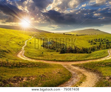Cross Road On Hillside Meadow In Mountain At Sunrise At Sunset