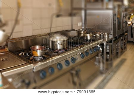 Real restaurant kitchen shot in operation, tilt shift blur