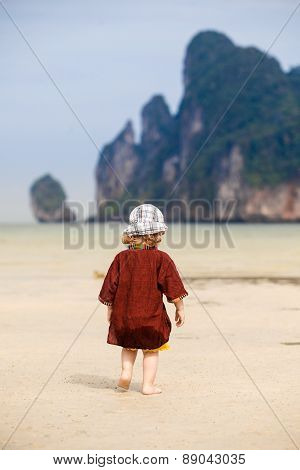 Child Walking On Fine Sand
