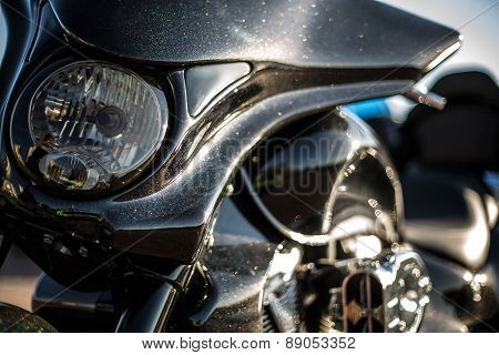 Black trike standing on the light street