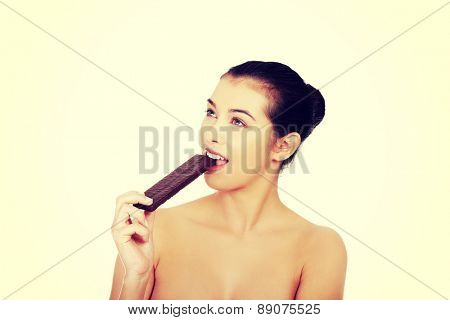 Beautiful woman eating a waffer