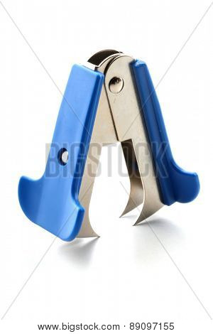 Staple remover on white background