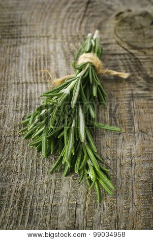 Rosemary bound on a wooden board