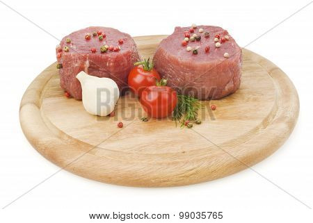 raw steak with pepper on wood