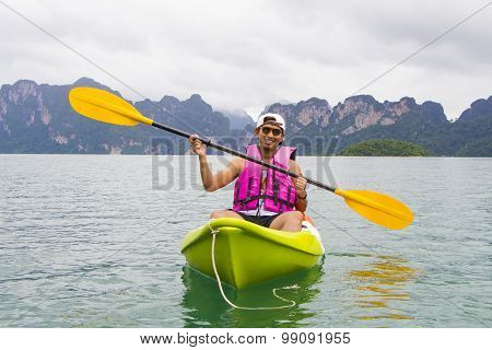 Young Asia man paddling