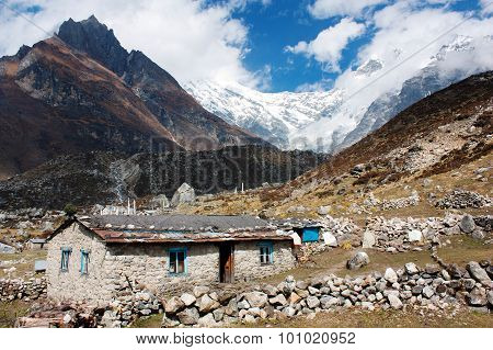 Nepalese Building In Langtang Valley And Langtang Peak