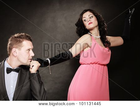 Man In Suit And Woman In Evening Dress.