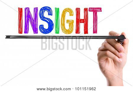 Hand with marker writing the word Insight