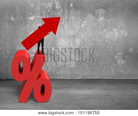 Businessman Holding Red Arrow Symbol Standing On Percentage Sign