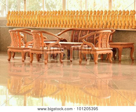 Brazen Goddess Of Mercy And Wooden Chairs