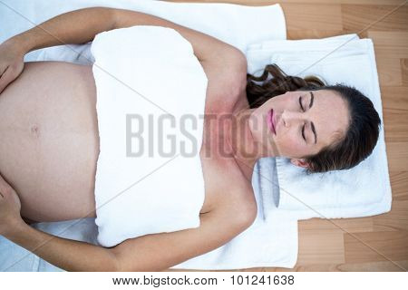 High anlge view of pregnant woman sleeping in spa