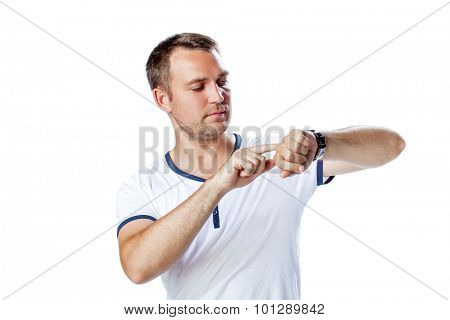 Worrier man running out of time looking his watch isolated on a white background 