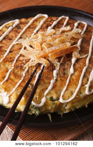 Japanese Pizza: Okonomiyaki On A Plate And Chopsticks. Vertical