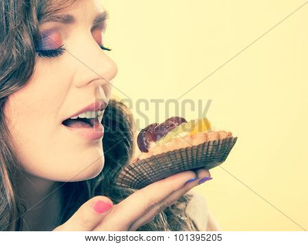 Woman Closed Eyes Holds Cake In Hand